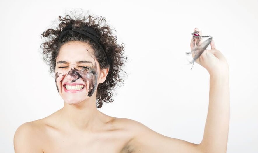 A woman does a rejuvenating facial skin treatment